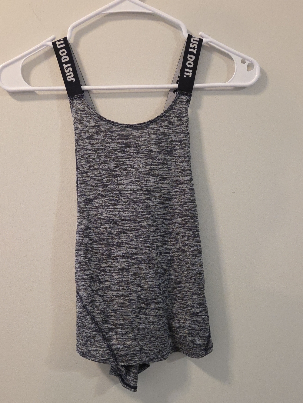 This Nike gray heather performance tank top features distinctive branded straps.